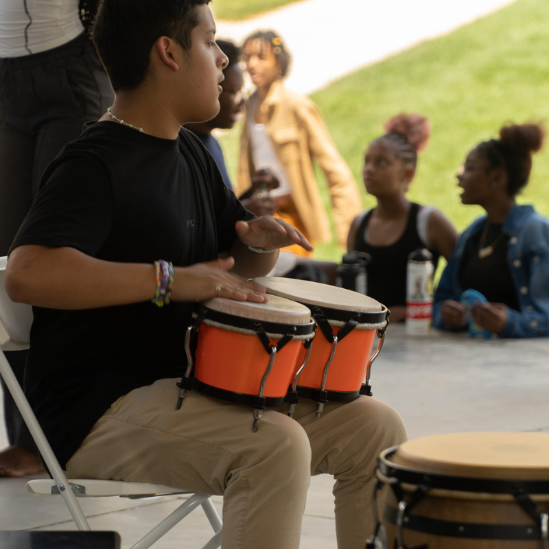 boy playing drums at the summer camp