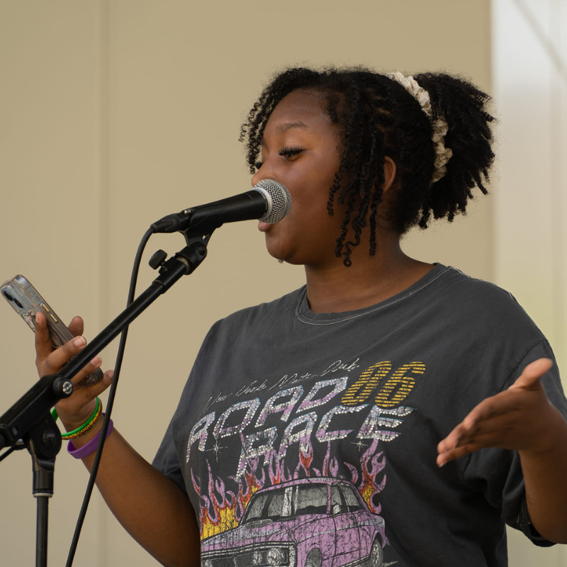 girl performs spoken word at arts camp